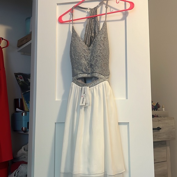 White skirt. sparkly mid section, with gray top. Cut outs w/ pearls and sparkles - Picture 3 of 4